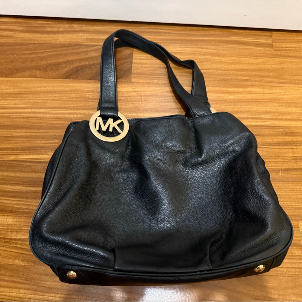 Shoulder designer handbag. Black leather